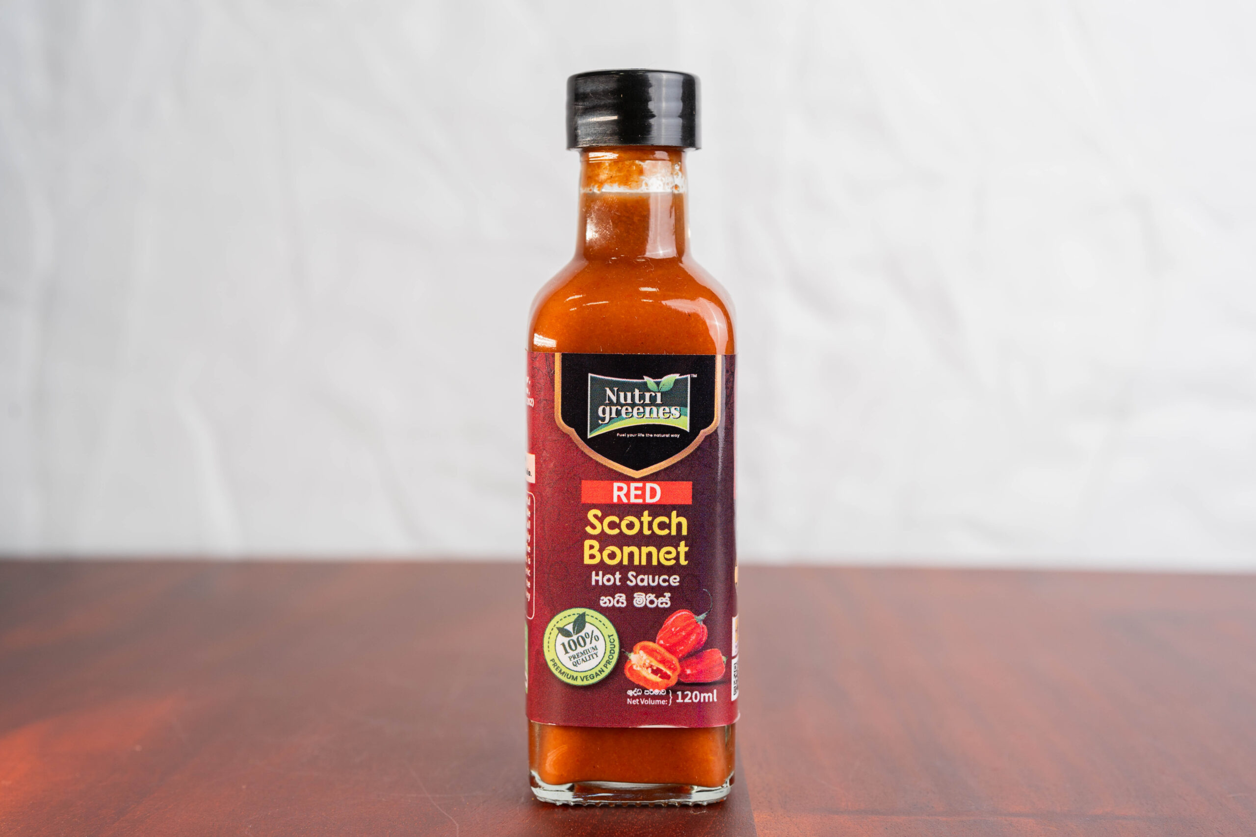 Nutrigreenes Red Scotch Bonnet Hot Sauce (120ml) – Natural Fermented Pepper Sauce Nutrigreenes Red Scotch Bonnet Hot Sauce 120ml bottle made with fermented Scotch Bonnet peppers